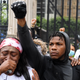 John Boyega stands in Parliament square during an anti-racism demonstration in London, on June 3, 2020